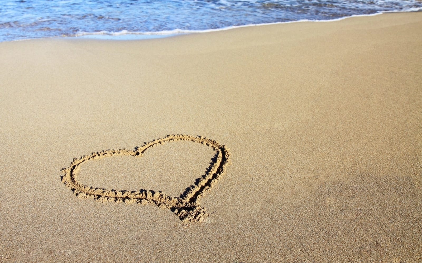 A heart drawn in the sand